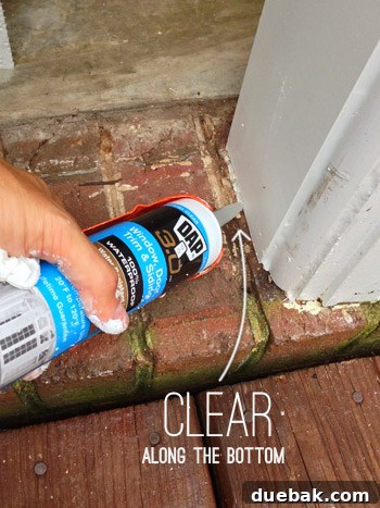 Close-up of clear silicone caulk applied against brick and trim for an invisible seal