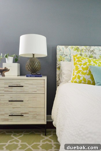 Master bedroom wall painted in Benjamin Moore Black Pepper, a dark sophisticated color