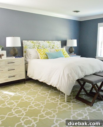 Close-up of Black Pepper paint on master bedroom wall with white crown molding and trim