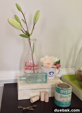 A single elegant lily stem displayed in an antique white milk jug, creating a minimalist yet charming floral accent.