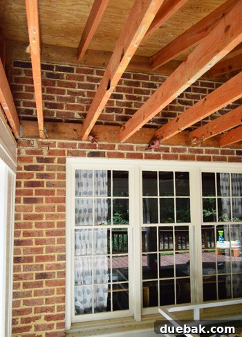 Demolishing Your Old Ceiling: A DIY Guide 12 Exposed rafters and joists in sunroom ceiling