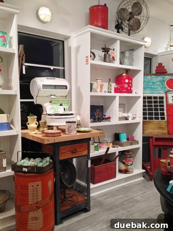 Seaside's Simple Pleasures: Window Shopping The Art of Simple 3 Interior view of The Art of Simple, showing clean white shelves, curated decor, and a harmonious color palette with pops of red and aqua.