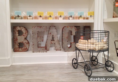Seaside's Simple Pleasures: Window Shopping The Art of Simple 10 Vintage metal letters with rich patina next to an old metal caddy, suggesting unique decor and functional storage ideas.