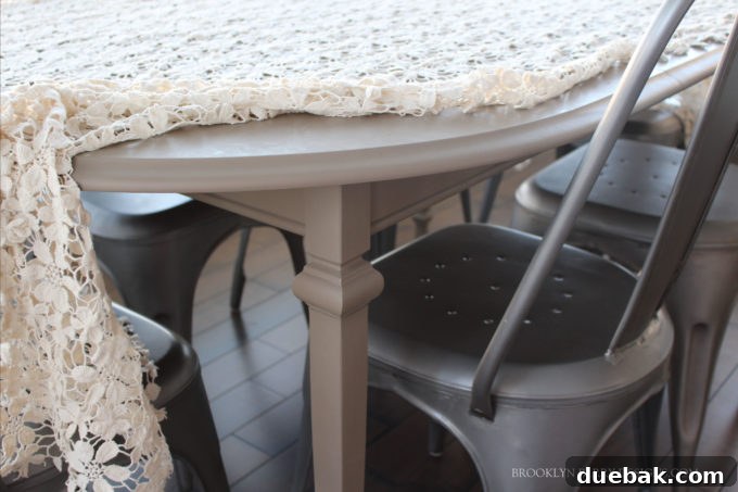 Stylish dining table set for a family meal, featuring contemporary chairs and warm lighting.