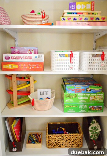 From Coat Closet To Toy Central 11 Close-up of organized toy baskets on the adjustable shelves within the transformed closet.