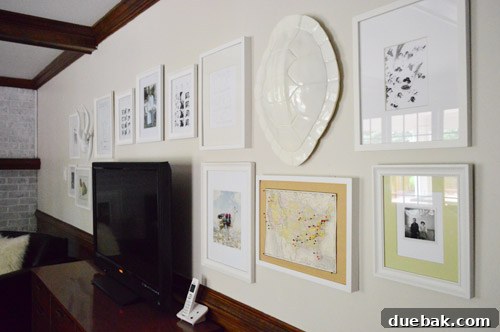 Final gallery wall layout with larger frames on the edges