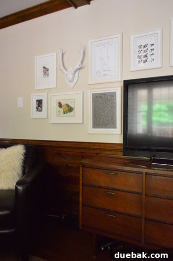 Close-up of the gallery wall featuring personal photos and art