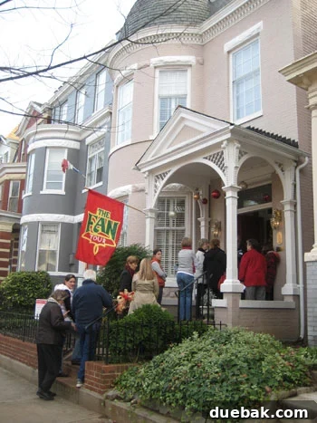 Historic Richmond Fan District Home Christmas Decor A historic home in Richmond's Fan District adorned with classic holiday decor, featuring a stately front door with a wreath.