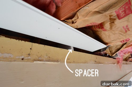 Setting the first ceiling plank straight