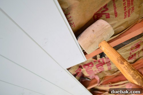 Installing ceiling planks with nail gun