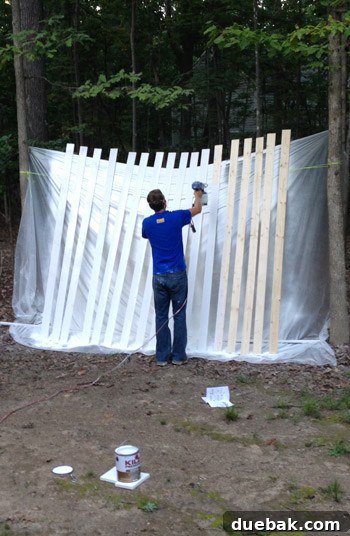 Painting station for wood planks