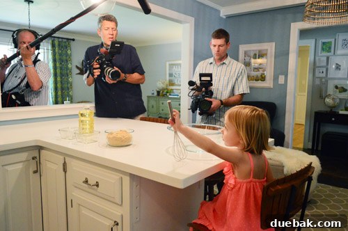 Clara baking cookies, looking like she's on her own cooking show