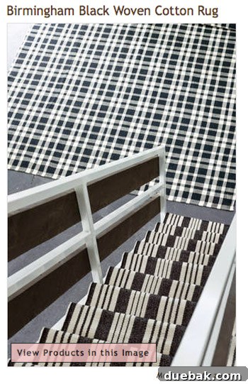 Transform Your Staircase with White Painted Balusters 4 Close up of a black and white striped Dash & Albert stair runner
