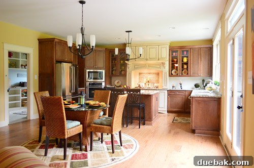 Traditional kitchen leading to a hidden prep kitchen behind a door