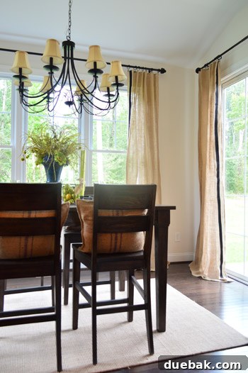 Breakfast nook with burlap curtains accented with black ribbon