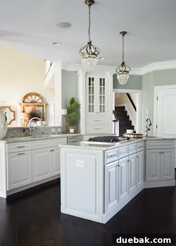 Unique kitchen layout with three parallel workspaces: peninsula, island, and appliance wall