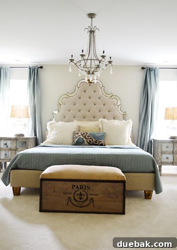 Upstairs main bedroom with an immense tufted headboard