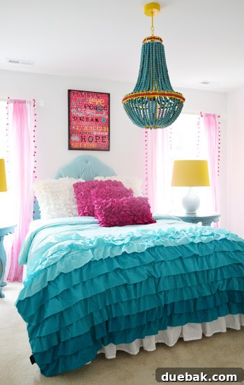 Girls' bedroom with yellow accents inspired by the chandelier