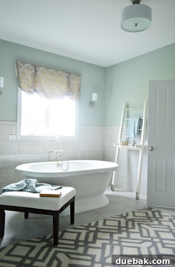 Luxurious en-suite bathroom featuring a large freestanding tub