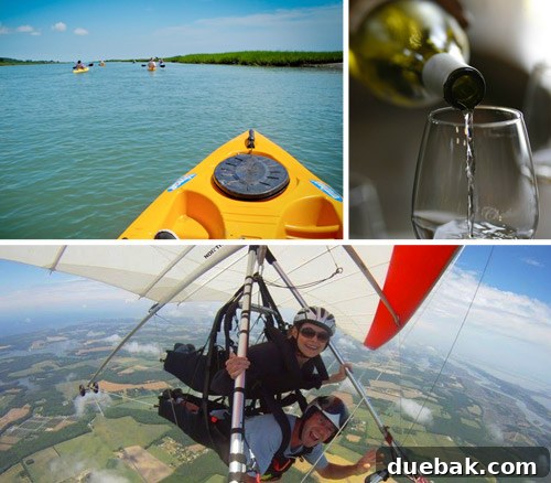 Two people hang gliding over a scenic coastal landscape