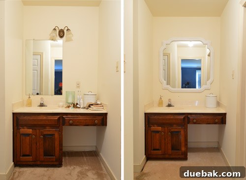 The large, white painted mirror now perfectly hung above the bathroom vanity, creating an illusion of space
