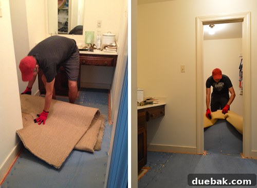 Rolled-up old carpet and blue foam padding after initial removal