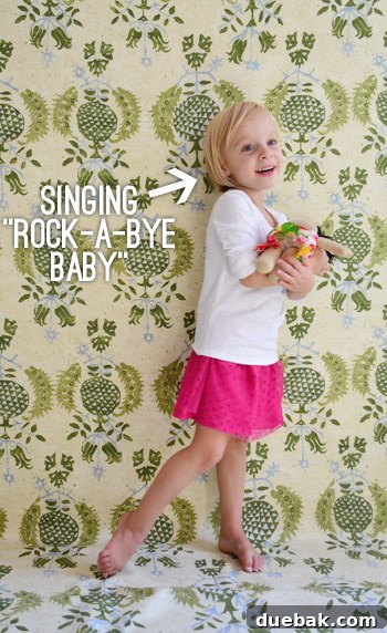 The Second Time Around: What to Expect 5 Clara, a sweet toddler, gently caressing her mother's pregnant belly with love and curiosity.