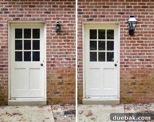 New black lantern light on back door with green brick
