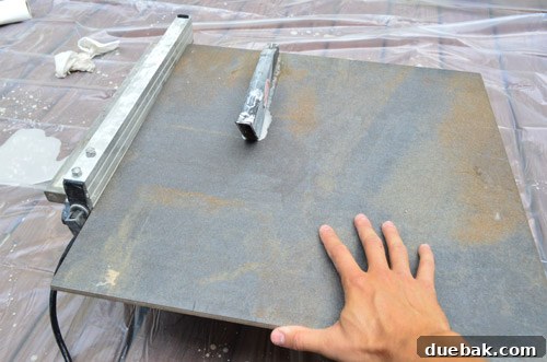 Outdoor Tile Perfection: Leveling and Dry Fitting 17 Cutting square tiles into border pieces using a wet saw