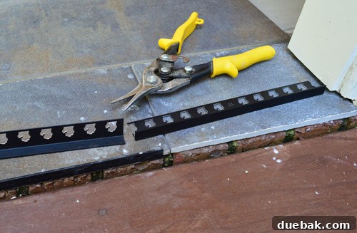 Outdoor Tile Perfection: Leveling and Dry Fitting 19 Metal edging pieces installed to protect and finish tile edges