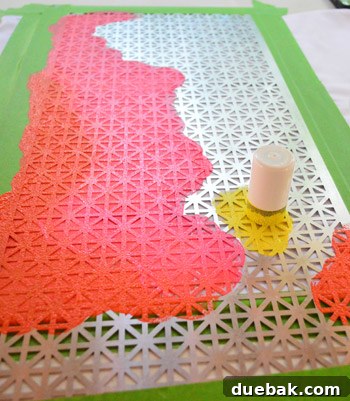 Applying paint to the grate stencil