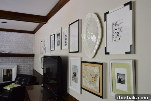 Uncovering Lead Contamination 4 Finished picture frames with black electrical tape accents, arranged on a wall.