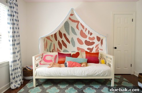 Photoshop mockup: Clara's room with a mural of colorful raindrops above the canopy.