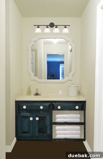 Revere Pewter: The Gray Paint Everyone Raves About 12 Digital rendering of bathroom with dark blue vanity