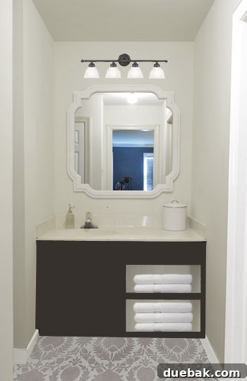 Revere Pewter: The Gray Paint Everyone Raves About 13 Digital rendering of bathroom with two-toned stenciled floor and light vanity