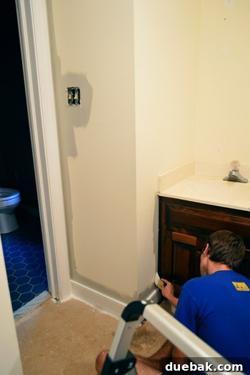 Revere Pewter: The Gray Paint Everyone Raves About 4 Close-up of intricate trim work and wall angles in a bathroom