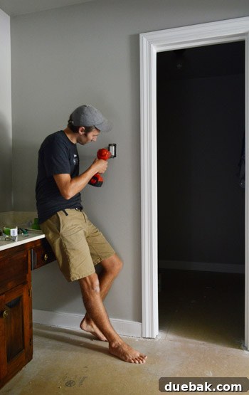 Revere Pewter: The Gray Paint Everyone Raves About 9 Close-up of new white light switch against Revere Pewter wall