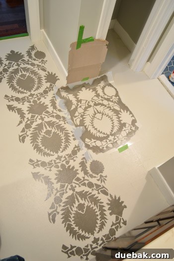 Design Your Dream Floor with Stencils 17 Stencil bent at a corner, with cardboard used to protect the baseboard from paint