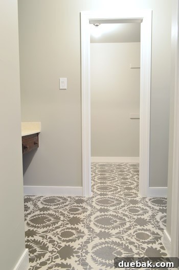 Design Your Dream Floor with Stencils 5 After photo of the newly stenciled subfloor, showcasing a geometric pattern in two-tone colors