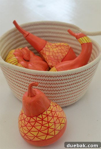Pumpkins Transformed: The Pantyhose Touch 3 Assortment of painted and unpainted faux gourds in various sizes and shapes, showcasing the potential for creative DIY Halloween decorations.