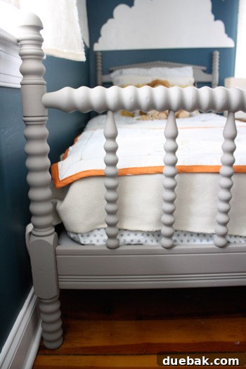 Celestial Blue Dreams: A Boy's Cloud-Kissed Sanctuary 4 Close-up of the refinished Jenny Lind bed