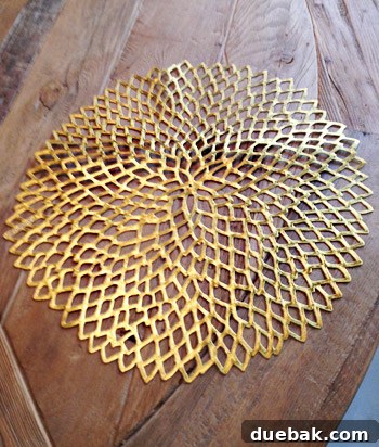 Close-up of a DIY gold belt made from a placemat, adding detail to a costume.