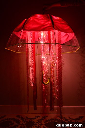 Clara's glowing jellyfish costume in a dark room, showcasing the effect of the added LED fairy lights.