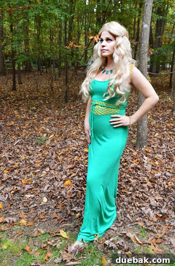 Woman dressed as Khaleesi from Game of Thrones, wearing a blonde wig, green dress, and DIY gold accessories.
