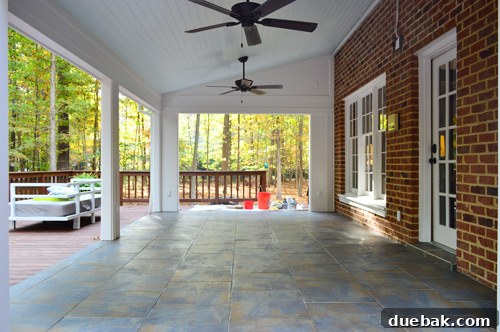 Groutless outdoor tiled floor awaiting the final grouting step, demonstrating the delays faced