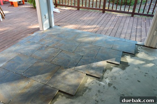 The second day of tiling, showing a much larger area of the outdoor floor completed with tiles