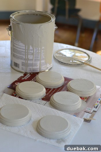 Painting round wood plaques with taupe color for keepsake base