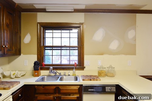How to Remove and Rehang Kitchen Cabinets 17 Kitchen progress shot, showing more open space after cabinet removal and relocation
