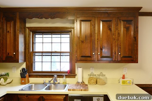 How to Remove and Rehang Kitchen Cabinets 3 Kitchen with upper cabinets, showing the long cabinet next to the window before removal