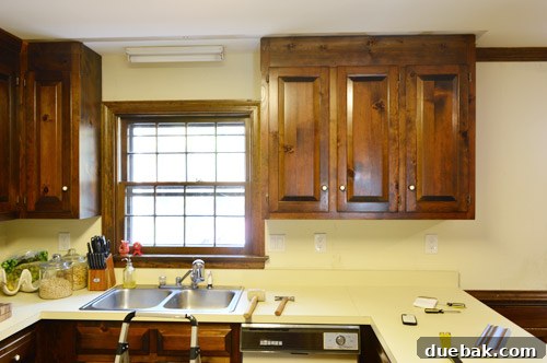 How to Remove and Rehang Kitchen Cabinets 5 Kitchen cabinet after crown molding removal, before the full cabinet demolition